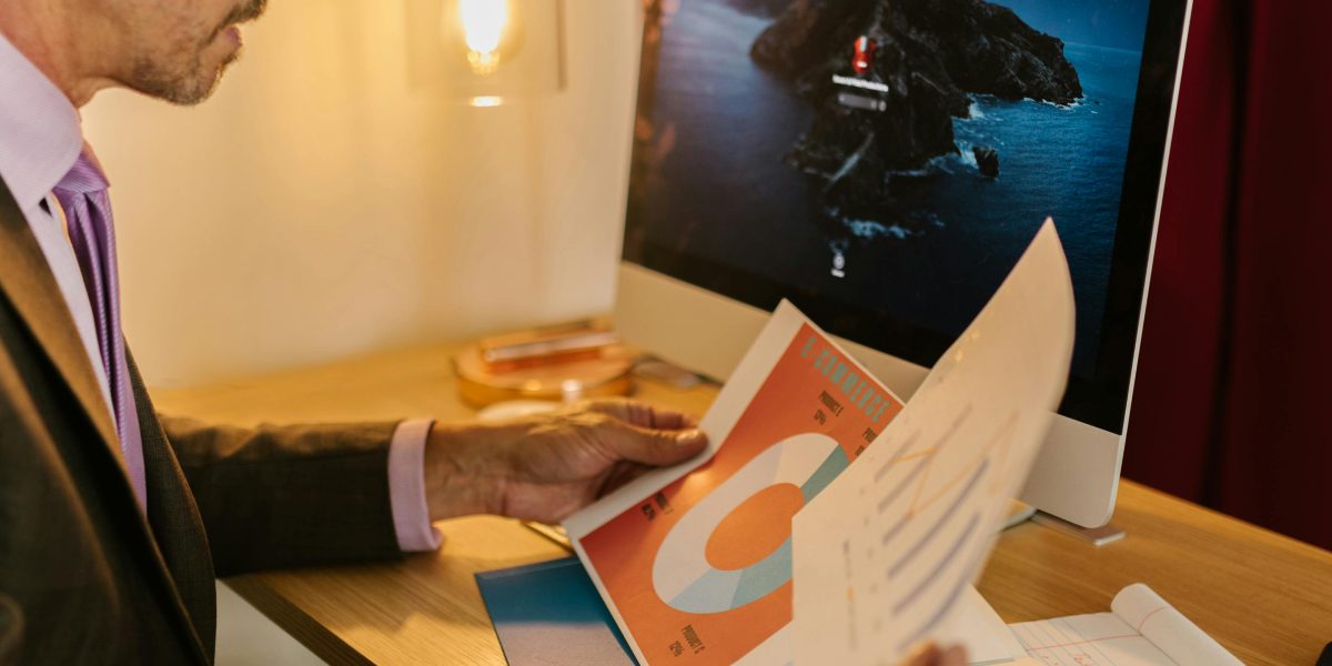 A confident real estate agent reviews a performance report, reflecting the positive results and ROI from marketing efforts.