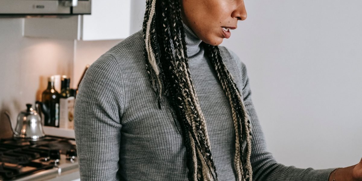 A real estate agent looking at their phone, appearing concerned about the lack of new leads.