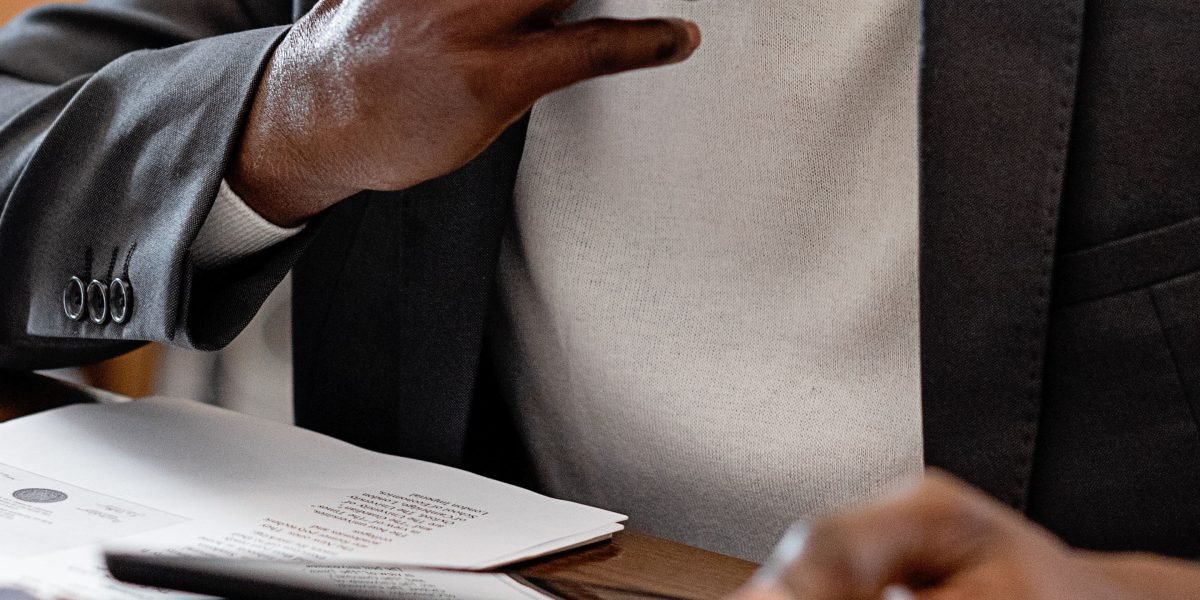 A person thoughtfully considers options, reflecting the careful process of choosing a marketing agency.