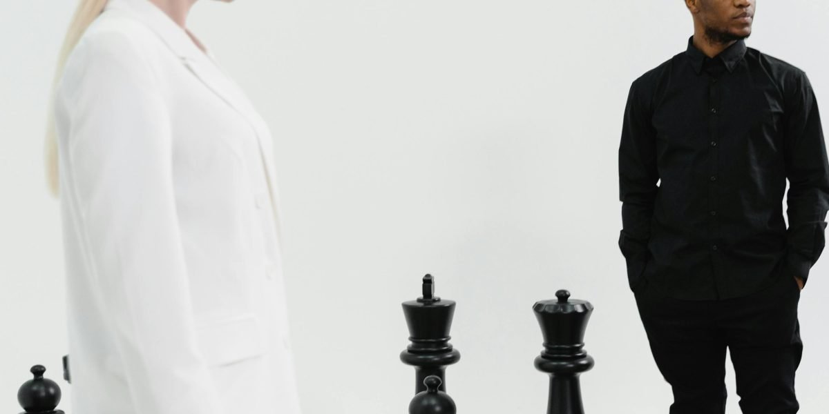 A real estate agent thoughtfully strategizing to stand out in a competitive market.