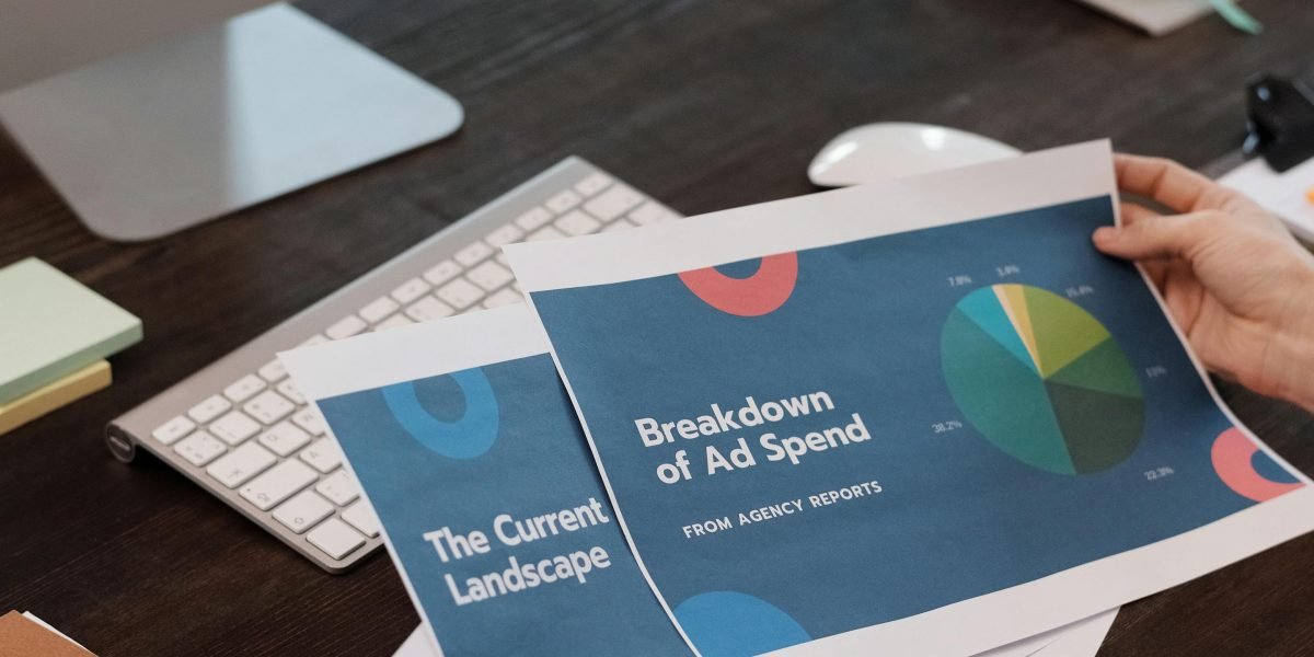 A professional analyzing charts and data on a tablet, focused on key performance indicators.
