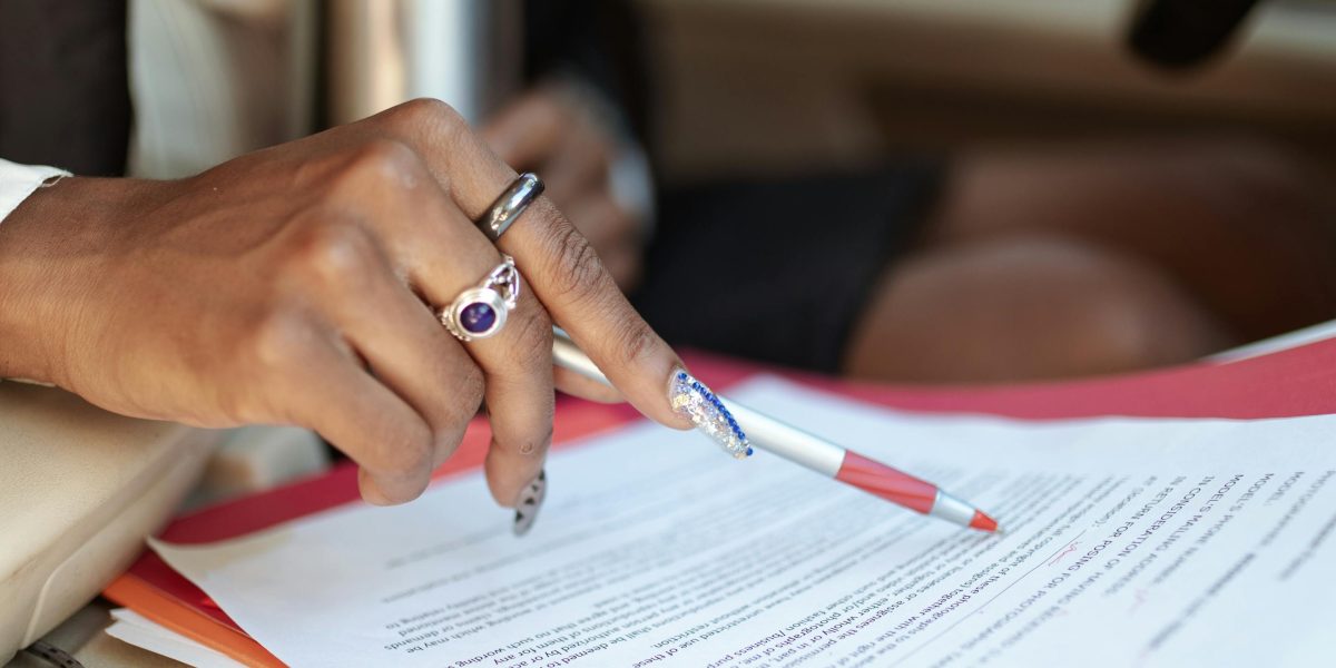 A professional reviews legal documents, emphasizing the importance of compliance with UAE data privacy laws.