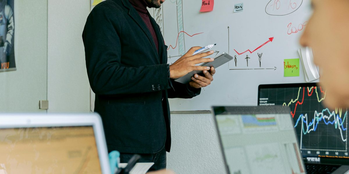 A business professional presenting data insights during a meeting, emphasizing transparency and data-driven decisions.