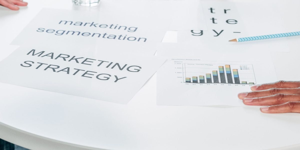 A marketing team actively discussing platform-specific strategies to optimize content for social media.
