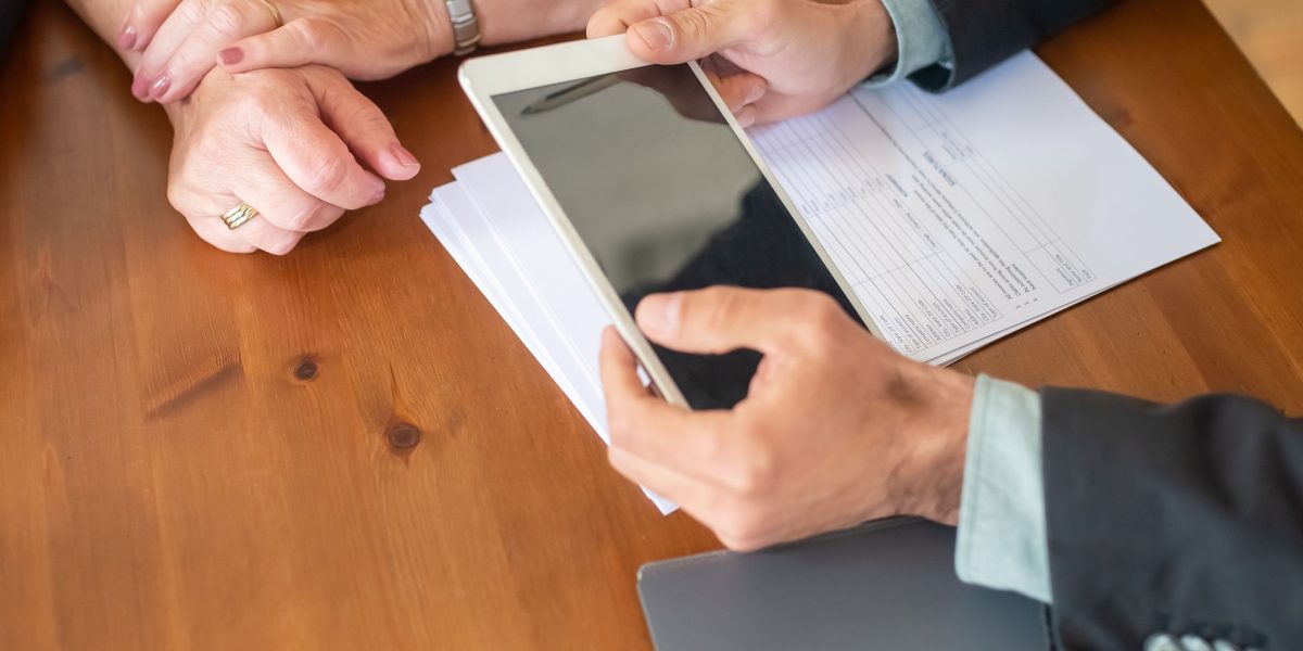 Professionals engaging in a discussion to evaluate and select the ideal social media marketing partner for their business.