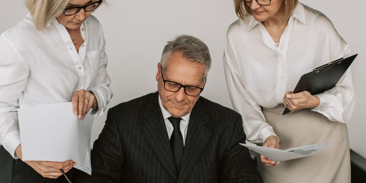 A team reviews charts and data, representing the process of measuring campaign ROI and making data-driven decisions.