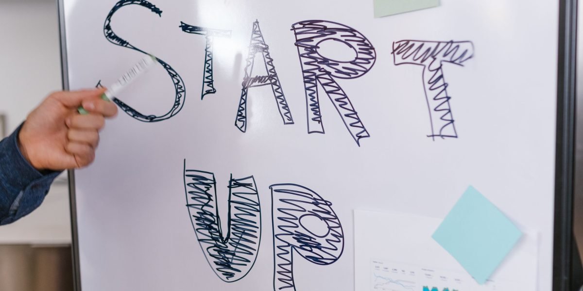 A person actively presenting ideas on a whiteboard, representing content strategy.