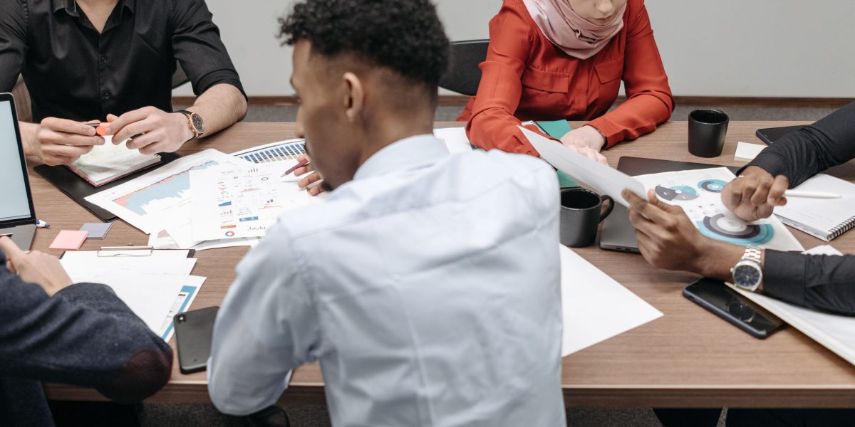 A diverse team collaborating, symbolizing efforts to connect with Dubai's bilingual real estate audience.