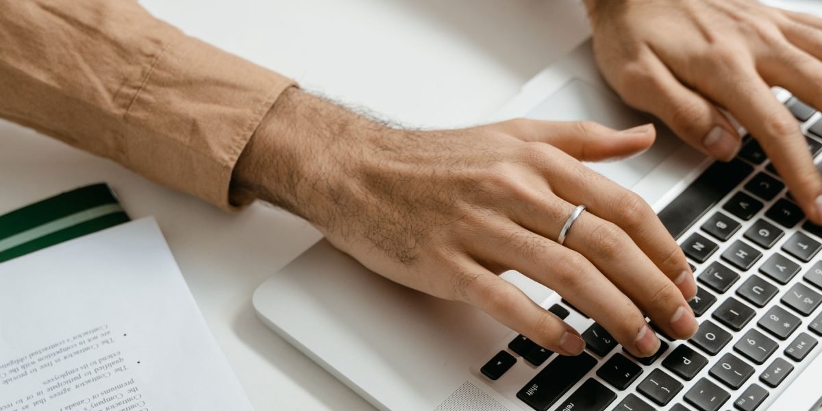 A potential buyer researching property listings on a tablet, highlighting the importance of a strong online presence.