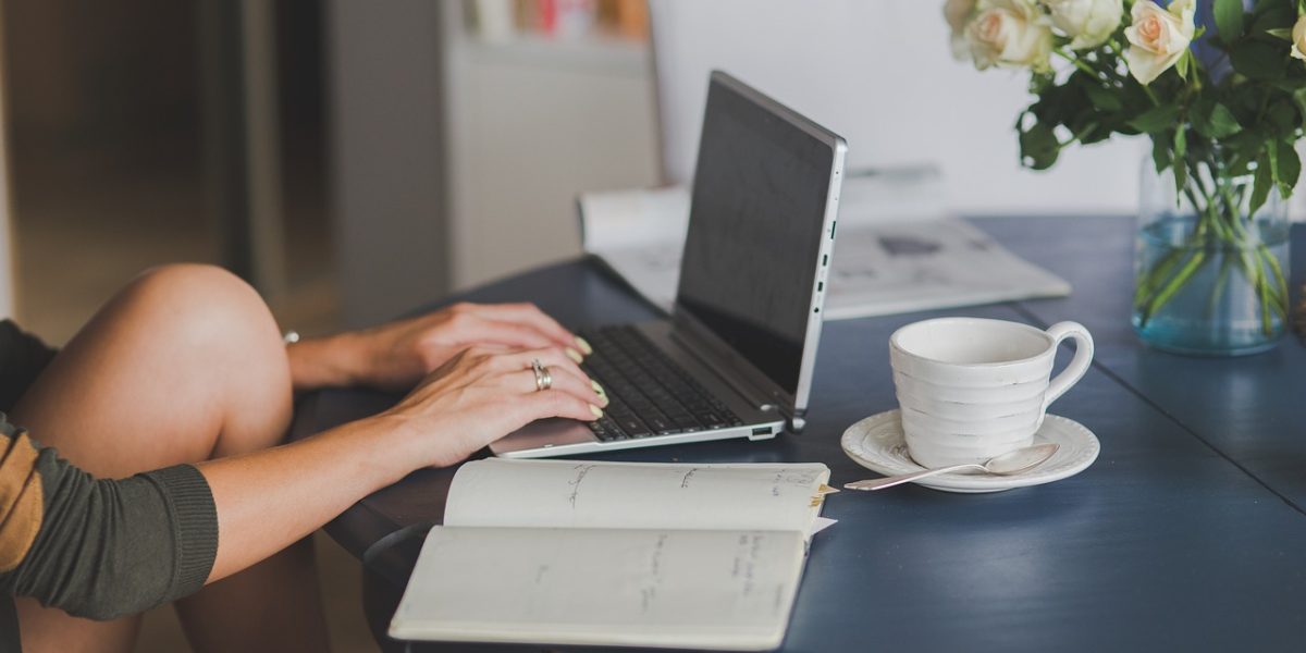 Someone focused on writing a blog post, reflecting the effort in creating helpful content for potential buyers.