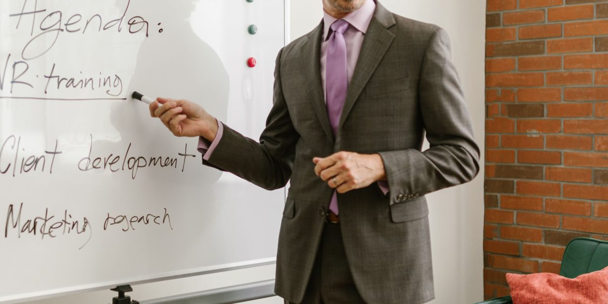 A team collaborating to outline an SEO strategy on a whiteboard.
