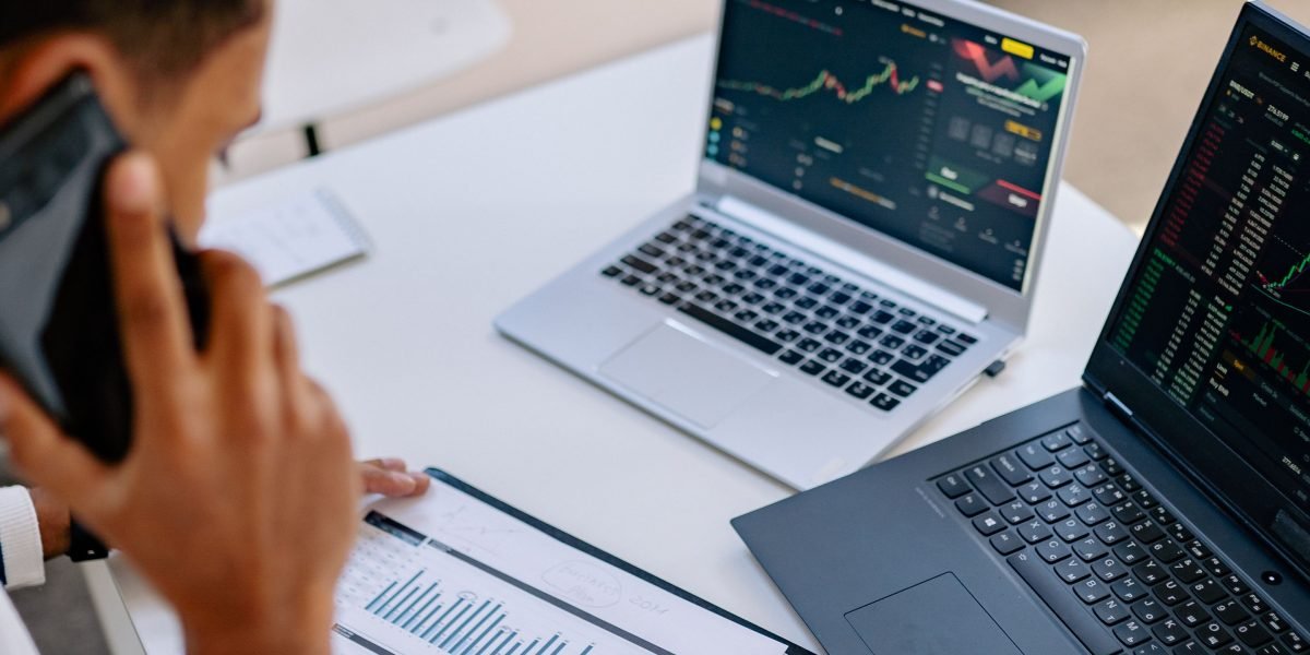 A business professional analyzing market data on a tablet, representing data-driven decision-making in campaigns.
