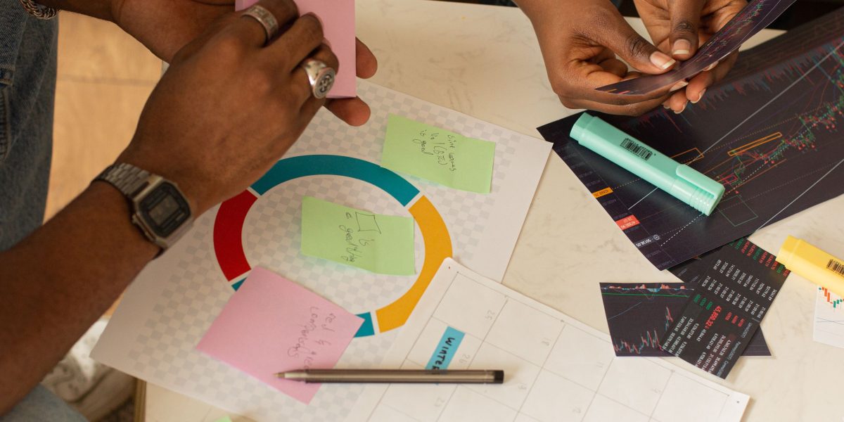 A marketing team collaborating on a campaign strategy, designing ads and landing pages.