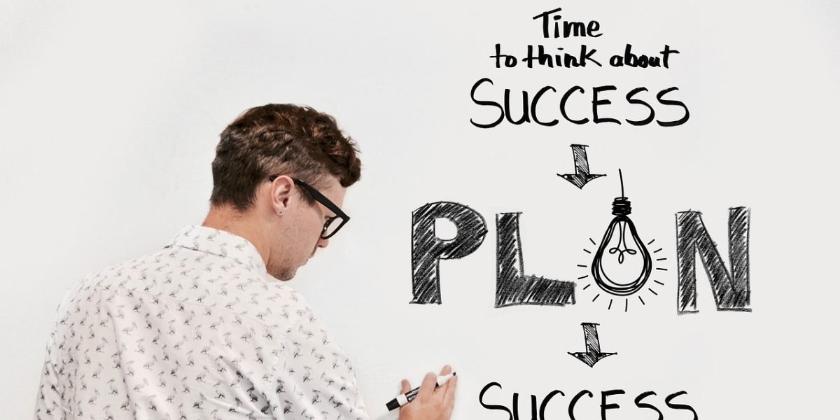 A professional thinking through their business objectives and desired outcomes.