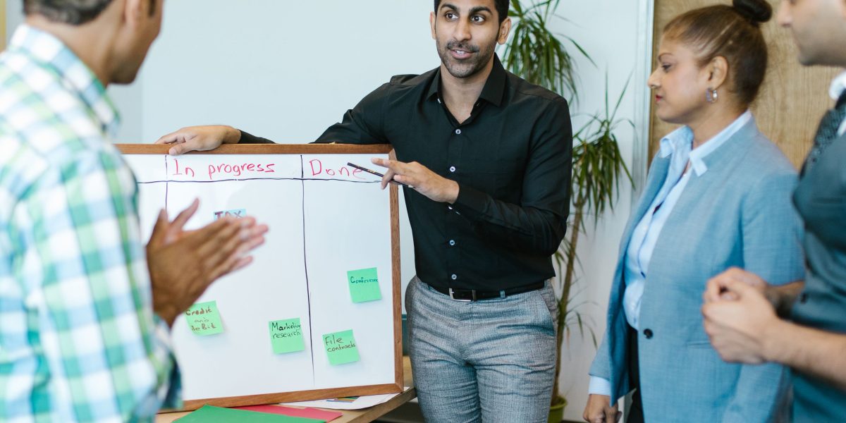 A small team collaborating to make strategic decisions for their business, reflecting the platform choice process.