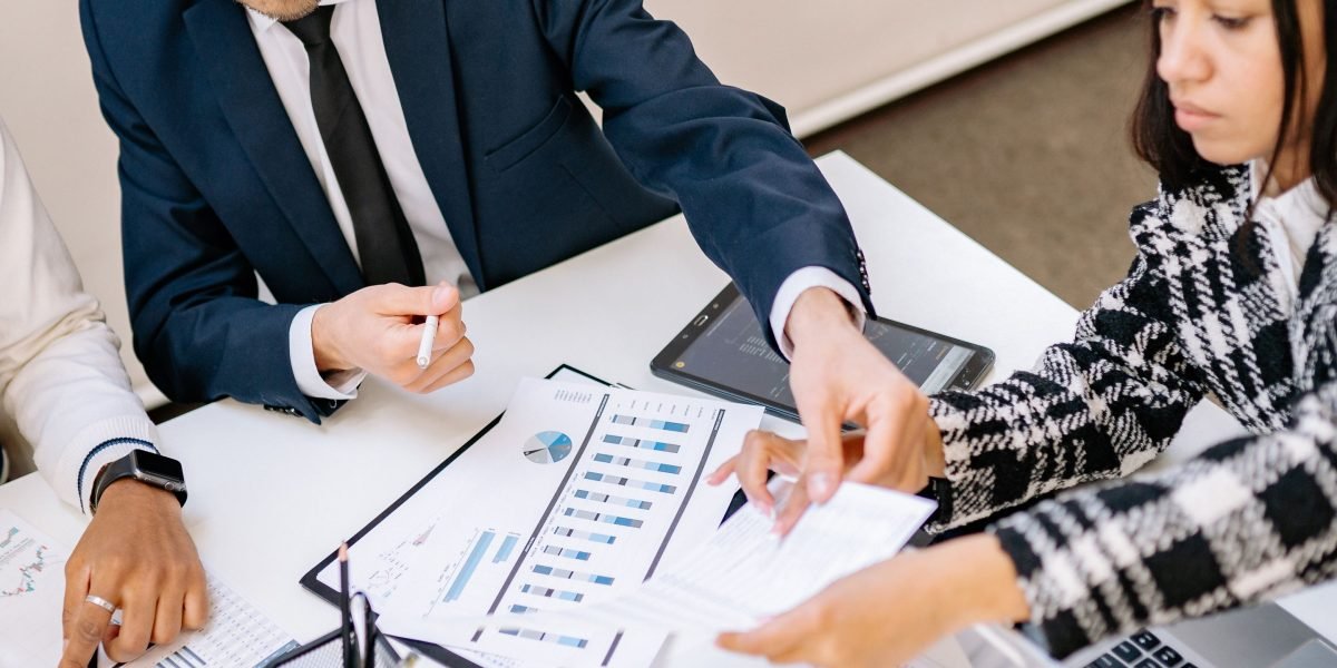 A diverse team of professionals celebrating a successful project or business growth, symbolizing positive ROI and scaling successful strategies.